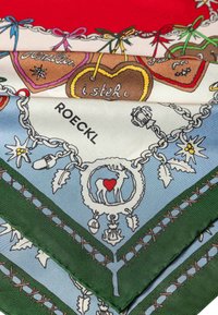 Silk scarf featuring a red, blue, and green color palette. Illustrations of hearts, a deer, and decorative chains. Text: "ROECKL."