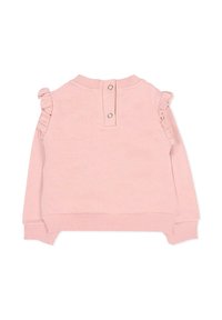 Felpa per bambini di colore rosa chiaro con dettagli a balze sulle spalle, polsini a costine e chiusura sul retro con bottoni. Tessuto morbido con un design casual.