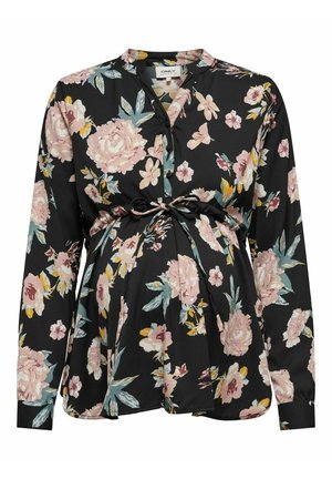 Blouse de maternité noire à imprimé floral rose et jaune, manches longues, boutonnée à l'avant, avec ceinture à nouer au-dessus de la taille.