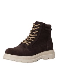 Bottes cheville en daim marron avec un design à lacets, semelles en caoutchouc crème et col rembourré. Présente des œillets en métal et des lacets contrastants.