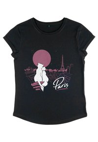 Svart t-shirt med en grafik av två stiliserade katter som sitter på tak, en stor rosa måne och Eiffeltornet, med "Paris" i vit skrift.
