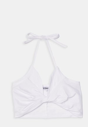 Hvit, kort halterneck-top laget av glatt stoff, med detaljer som knute foran og justerbare bånd ved nakken.