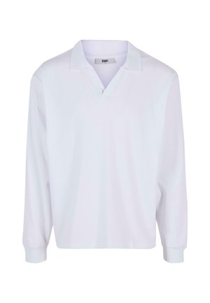 Long-sleeve white polo shirt in cotton fabric, featuring a V-neck collar, ribbed cuffs, and a relaxed fit for comfort. Brand label visible inside collar.