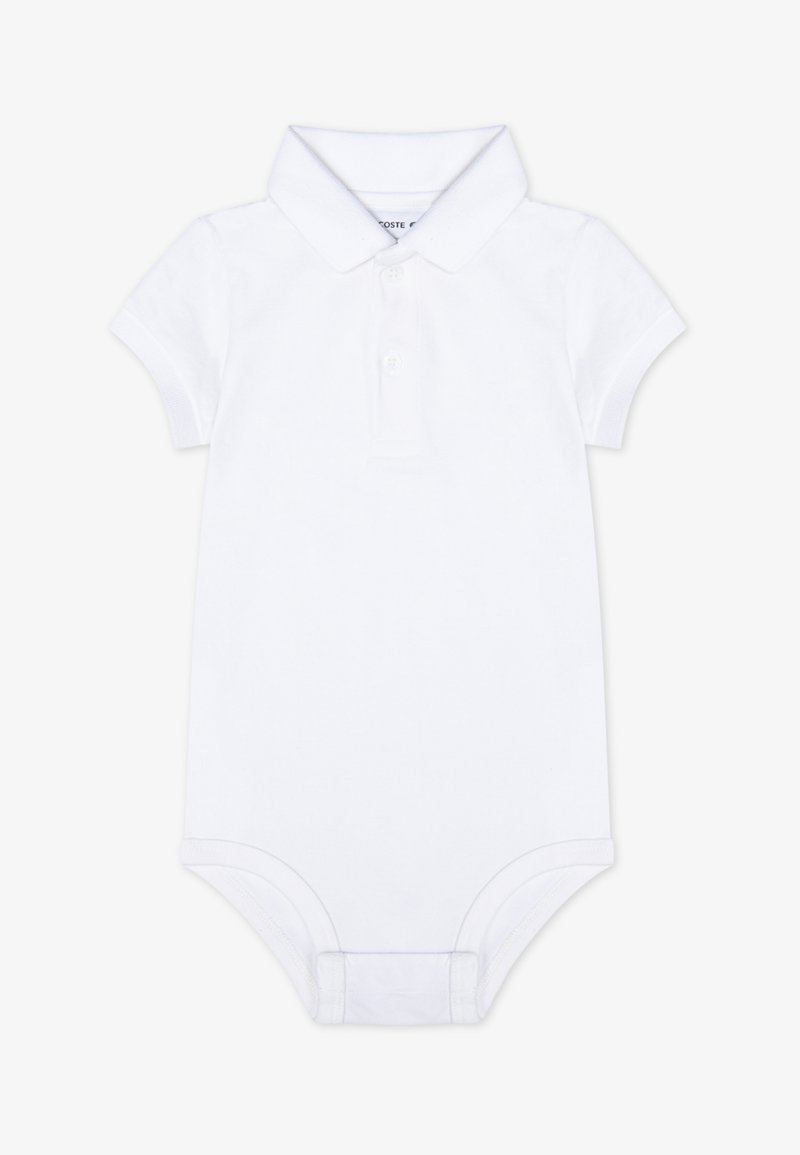 Fehér, rövid ujjú polo bodysuit puha pamutból, gallérral, három gombos kivágással és patentos zárással az alján.