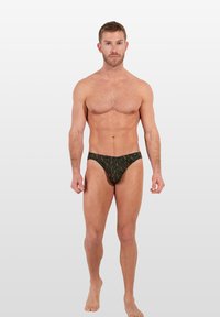 Männliche Schwimmbadehosen in Dunkelgrün mit einem tropischen Blatt- und Blumenmuster, ausgestattet mit einem engen Schnitt und einem weichen Stoffgefühl.