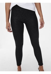 Svarta leggings med ett subtilt leopardmönster, gjorda av ett elastiskt material, med en figurnära passform och en slät, fantastisk yta genom hela plagget.
