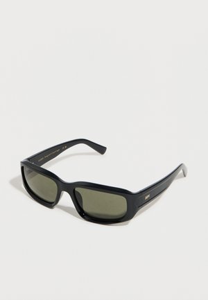 Black rectangular sunglasses with dark green lenses and subtle gold branding on the temple, displayed on a white surface.