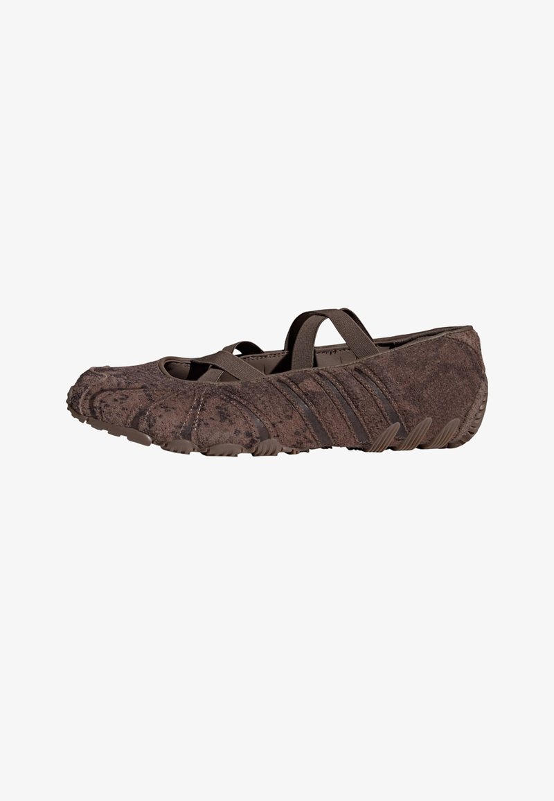 Brown suede slip-on shoe with elastic cross straps and textured rubber sole, designed for lightweight comfort and flexible fit.