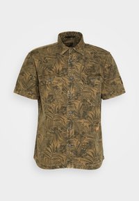 Korte mouwen shirt in olijfgroen met een bladerenpatroon. Voorzien van twee borstzakken, grijze knopen en een klein oranje accentlogo.