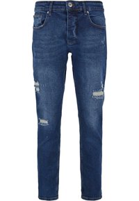 Slim-fit, temno modri jeans z raztrganinami in diskretnimi madeži, ki imajo pet žepov ter zadrgo in gumbasto zapiranje.