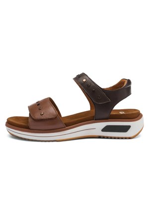 Brown and dark brown leather sandal with two adjustable straps, metallic accents, cushioned insole, and a white rubber sole with grooves.