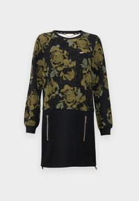 Robe noire à manches longues, ornée d'un motif floral vert sur le haut. Comprend deux poches zippées à l'avant et un ourlet simple.