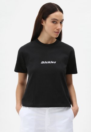 T-shirt nera in cotone con maniche corte e scollatura a girocollo, con testo ricamato bianco "Dickies" sul davanti. Texture liscia.