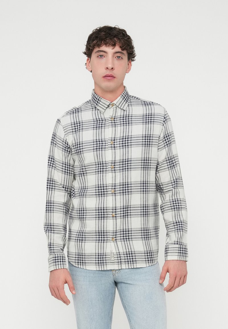 Πουκάμισο με κουμπιά σε εκρού χρώμα με σχέδιο καρό σε ναυτικό μπλε, με γιακά και μακριά μανίκια, κατασκευασμένο από ελαφρύ ύφασμα με χαλαρή εφαρμογή.