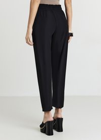 Calliope UNITA - Pantaloni sportivi - ultrablack