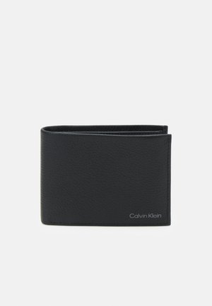 Black leather wallet with a pebbled texture, bi-fold design, featuring a silver Calvin Klein logo on the bottom right corner.