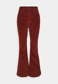 Pantalon évasé en velours côtelé de couleur rouille, doté d'une taille haute, de poches avant et d'une texture lisse. Fermeture par bouton métallique à la taille.