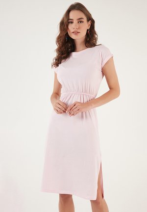 Light pink, knee-length dress with short sleeves, elastic waistband, and side slits. Made of a soft, smooth fabric.