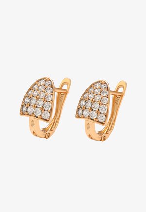 Gold earrings with curved hinges, each featuring a triangular cluster of small round clear gemstones.