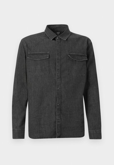 Dark grey denim shirt with long sleeves, pointed collar, two chest pockets, and button front closure. Features stitched detailing on shoulders.