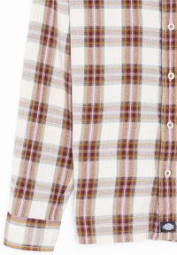 Camisa a cuadros en blanco, rojo, amarillo y púrpura. Tejido de mezcla de algodón con cierre de botón y puños doblados. Etiqueta de logo en el dobladillo.