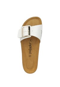 White slide sandal featuring a single adjustable buckle strap, brown cushioned footbed, and a textured insole for comfort.