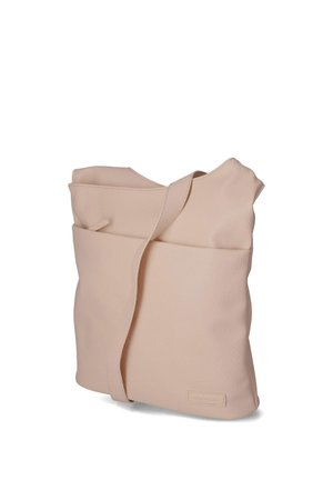 Soft beige leather shoulder bag with wide strap, front pocket, and subtle brand patch near bottom edge.