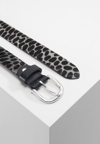 Leopard print belt with a smooth black leather buckle; sleek, metallic silver hardware; features a textured animal print design.