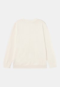 Pull blanc long à manches longues avec des poignets, un ourlet et un col côtelés, vu de dos sur un fond neutre.