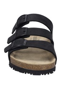 Sandale noire avec trois sangles ajustables, semelle en liège et semelle en caoutchouc texturé. Dotée d'une finition en daim doux et de boucles en plastique.