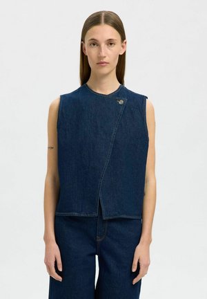 Denim sleeveless top in dark blue, featuring a slightly asymmetrical design, round neckline, and a side snap closure. Smooth texture.
