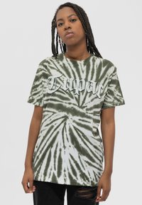 Green and white tie-dye t-shirt featuring the word "Tupac" in bold white lettering. Short sleeves and a relaxed fit.