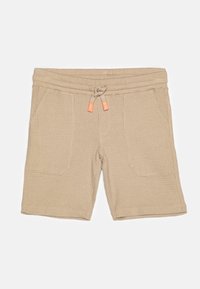 Beige bomullsshorts med et teksturert mønster, elastisk midje og snor; har to frontlommer og oransje detaljer.