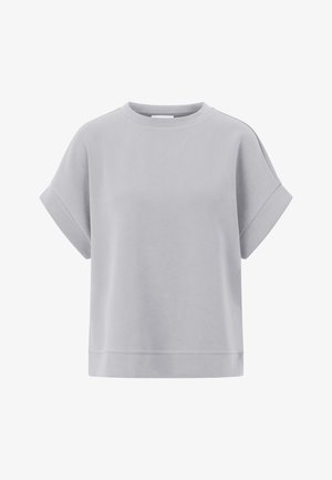 Heled hall, lühikeste varrukatega, ruudukujuline dressipluus ümmarguse dekolteega ja mansettvarrukatega. Pehme tekstuur ja mugav lõige.