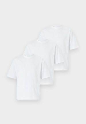 Three white cotton t-shirts with short sleeves and round necklines, displayed together on a plain background. No patterns or accents visible.