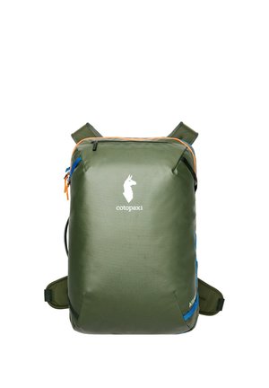 Square-shaped olive green Cotopaxi backpack with orange zipper accents and blue side detail, shoulder straps, and logo on front center.