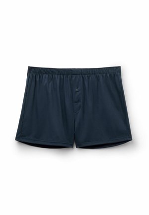 Navyblauwe katoenen boxershorts met een elastische tailleband, een enkele knoopsluiting, en een klein pocketdetail aan de voorkant voor comfort.