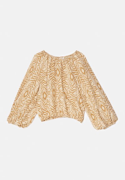 Kerge beeži pluus, millel on abstraktne laineline muster tumedamates toonides. Omab rüüsile volditud kaelust ja volangilisi, elastseid varrukaid.