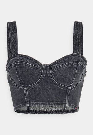Black denim cropped bustier top with structured cups, wide straps, and contrast stitching; features a zip closure on the side.