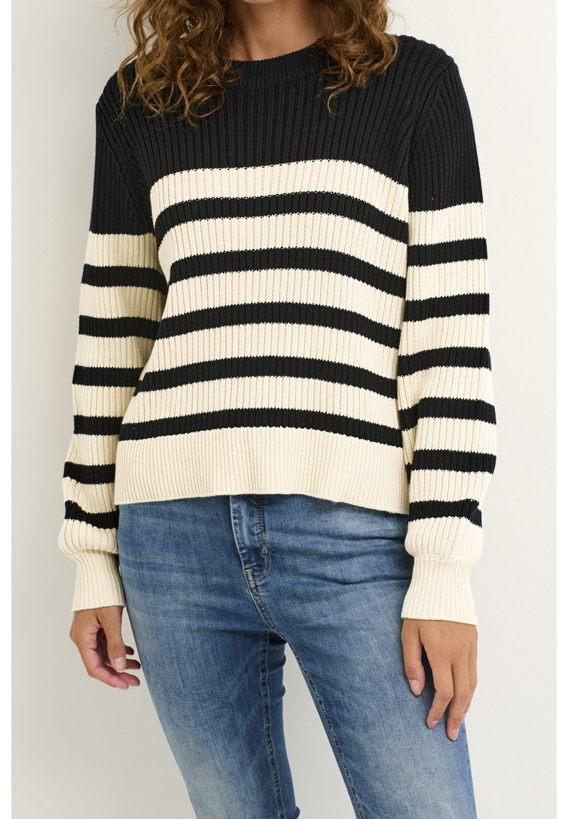 Bomullströja med svarta och gräddvita horisontella ränder, ribbat mönster, rund halsringning och långa ärmar med passande mudd.