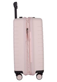 Valigia rigida di colore rosa chiaro, con una superficie strutturata. Dotata di una doppia zip e di un manico retrattile, supportata da quattro ruote.