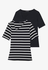 Two t-shirts: one solid black, one black and white striped. Both have short sleeves and v-neck designs. Labels visible on the neck.