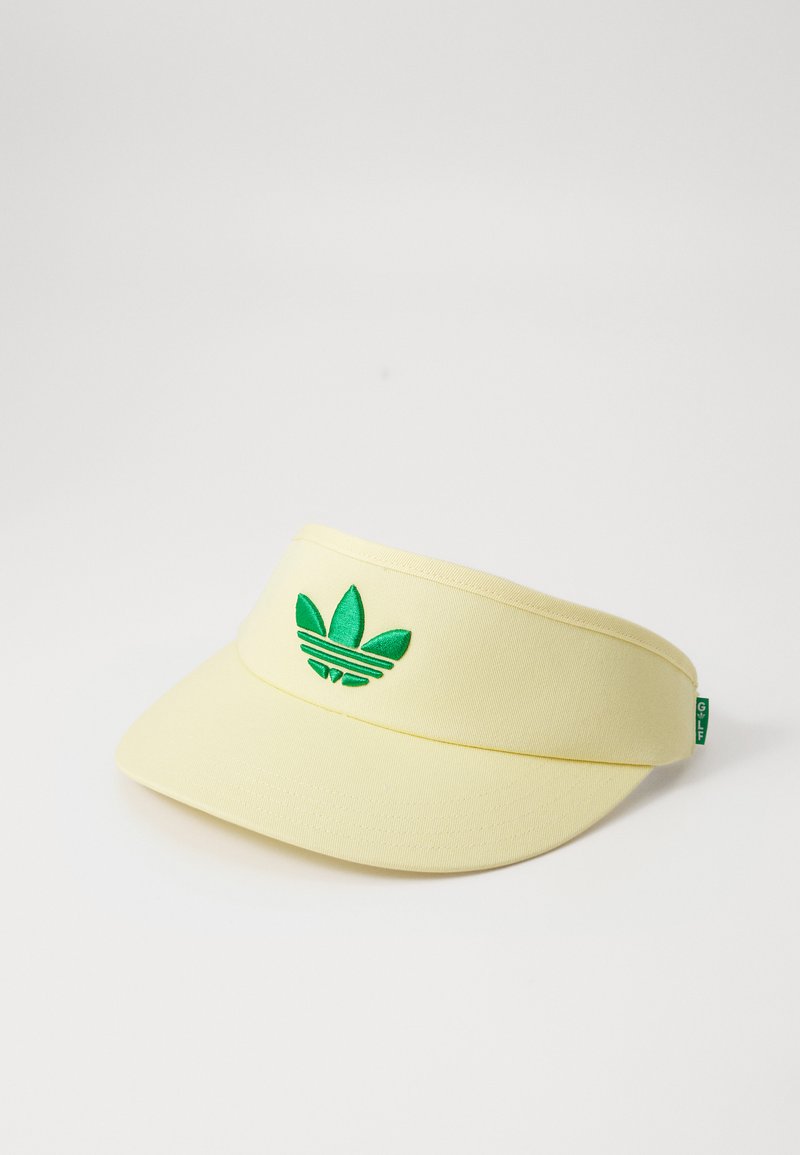 Cască de soare galbenă cu logo brodat verde. Fabricată din material textil, are o vizieră curbată și o curea ajustabilă în spate.