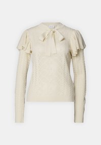 Maglione lavorato a maglia color crema con una texture a motivo, caratterizzato da un papillon al collo e maniche a volant. Maniche lunghe, design aderente.