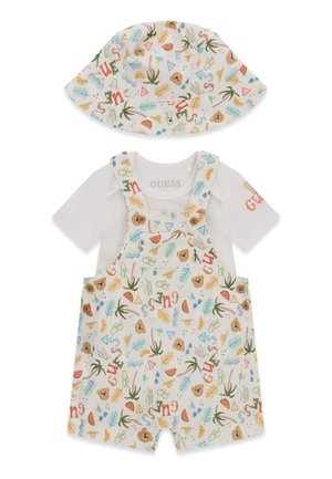 Set composto da tutina bianca per neonati e cappello a secchiello con stampa tropicale multicolore, che include palme, orsetti, angurie e la parola "GUESS" distribuita su tutta la superficie.
