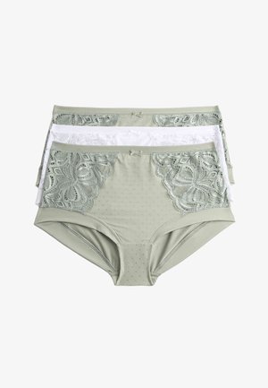 Tre coppie di biancheria intima da donna: una verde chiaro con dettagli in pizzo, una bianca con pizzo e una verde chiaro con motivo a pois.