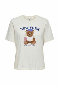 Cremefarvet T-shirt med korte ærmer, som har et grafik af en bjørn med en blå kasket og en drink, teksten siger "NEW YORK Drømmenes By."