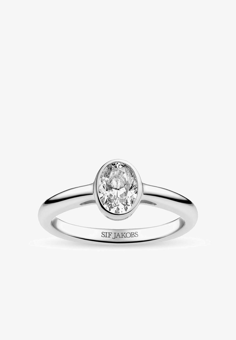 Bague en argent avec une pierre précieuse claire taillée en ovale, sertie dans un chaton, gravée de "SIF JAKOBS" sur la face intérieure.