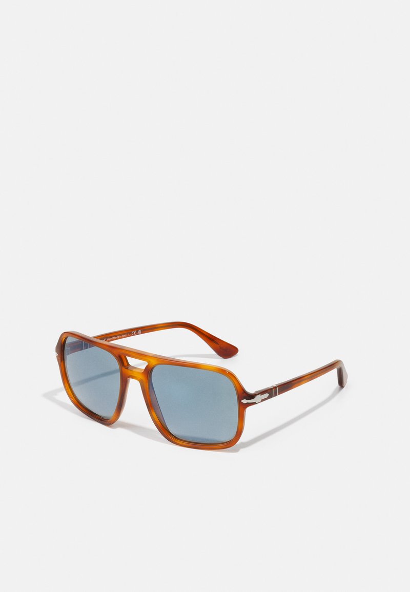 Brown tortoiseshell rectangular sunglasses with blue lenses. Features silver accents on the temples and a glossy finish.
