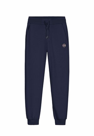 Pantalones jogger azul marino con cintura elástica, cordón ajustable, bolsillos laterales, puños acanalados y pequeño logo circular en el muslo derecho.